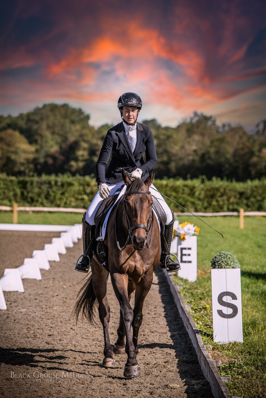 A dressage rider on a horse after a dressage competition